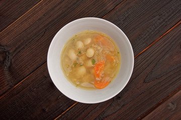 Cabbage soup with vegetables on a table