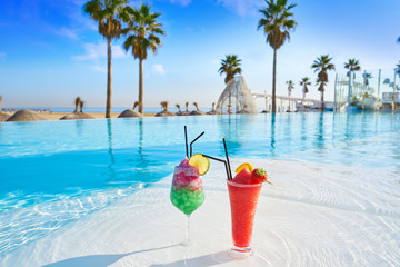 Tropical cocktails in resort infinity pool
