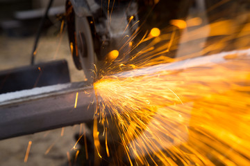 Sparks from metal cutting at the construction site