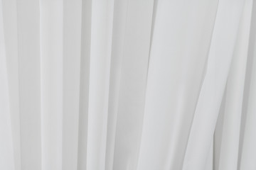 White fabric texture background. Crumpled of curtains material.