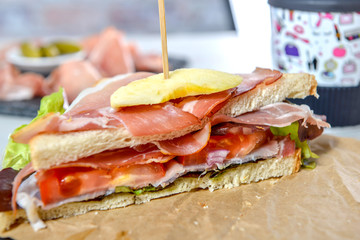 sandwiches with salad, tomatoes, ham and onions