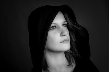 portrait of hooded woman - black and white image