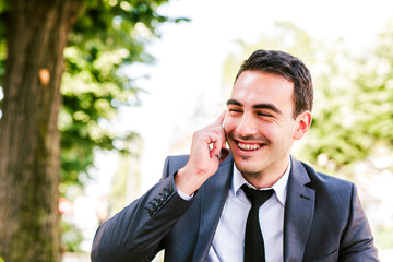 Young businessman talking on cellphone