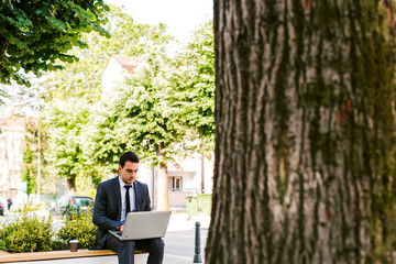 Fototapeta premium Young economist use laptop outdoor