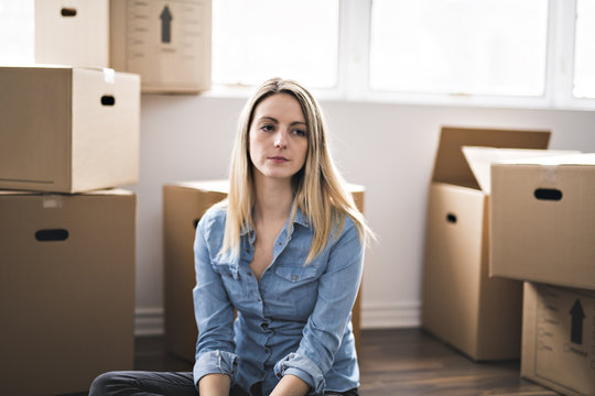 A woman with box at home