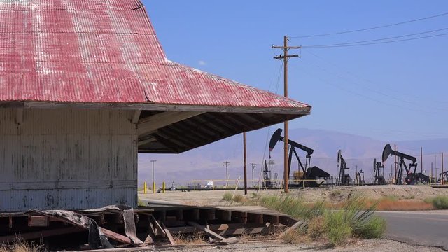 Oil fields and derricks near Bakersfield, California.