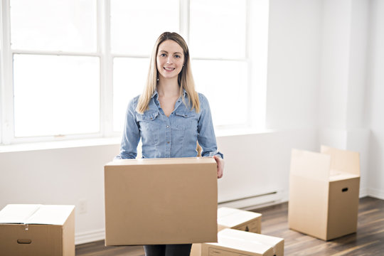 A woman with box at home