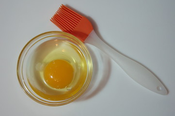 Egg yolk and pastry brush.