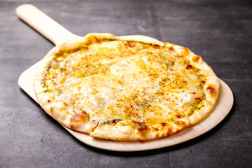 Pizza Four Cheese with a Vessel Assortment on the Stone Background Baking Snack