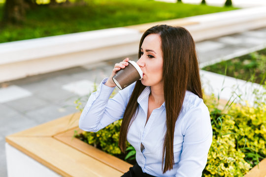 Female Student Drinks Coffee To Go