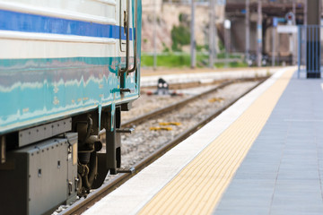 Horizontal View of a Train Stopped in a Railway Station on Blur Background