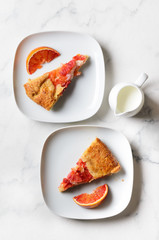 Two pieces of citrus pie. Flat lay.