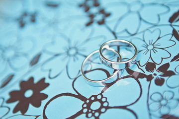  Wedding rings on a blue metal box