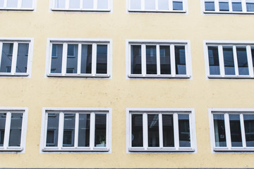 Fototapeta premium facade building with windows at daylight with reflections