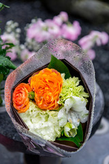 Beautiful bouquet of flower wrap with plastic in outdoor background