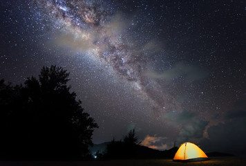 Night sky photograph with Milky Way core. Image contain soft focus, blur and noise due to long...
