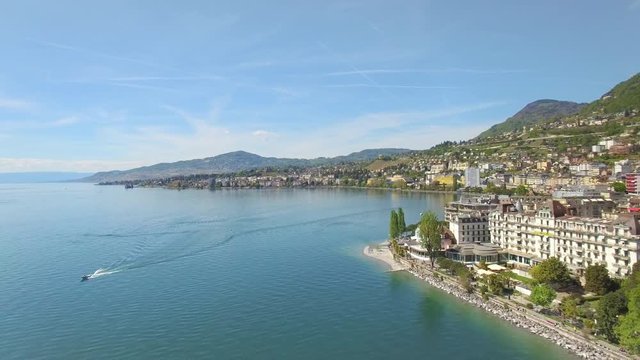 4K aerial shot of a lovely swiss city surrounded by nature. Montreux Riviera Golden Pass area