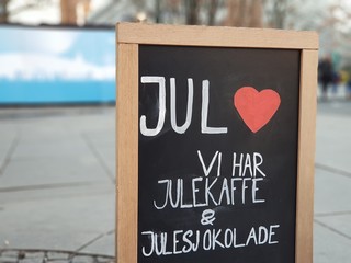 Sign saying "Christmas. We have Christmas coffee and chocolate" in Norwegian