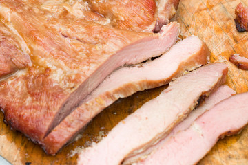 Close up tasty slice grilled pork on wooden board