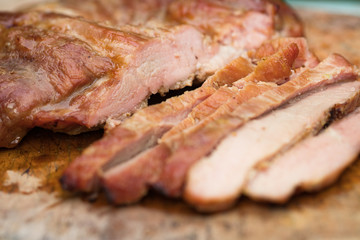 Close up tasty slice grilled pork on wooden board