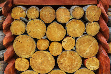 The texture of logs of medium size, stacked on top of each other.