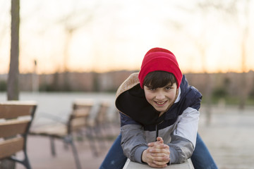 Young teenager portrait wearing a red hat