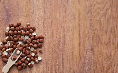 Healthy concept . Haselnut on the wooden background . 