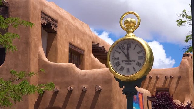 A beautiful shot of a clock near Santa Fe New Mexico adobe architecture.