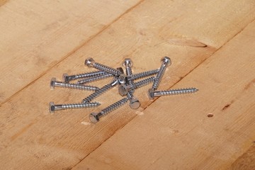 Hexagon screws on a wooden floor
