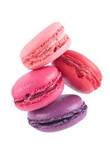 4 delicious pink cookies falling down isolated on white