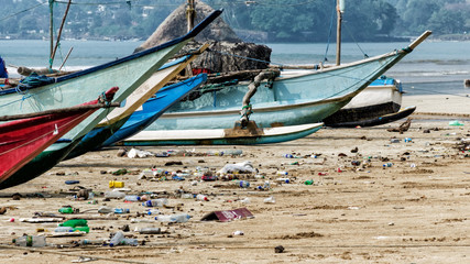 Pollution of river, sea, ocean water with garbage, waste, plastics garbage - back side of tourism and modern life.