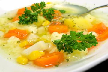 White Bowl of Vegetable Soup with Potato, Carrot