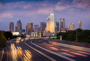 Plakat Long exposure of evening rush hour with cars racing in and out of Downtown Dallas, Texas on a stormy night.