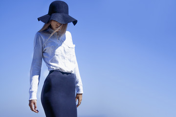 Summer trips. Young woman standing on a  mountain road  and is ready for summer vacation.