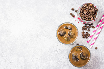 Iced caramel mocha latte on concrete background. Top view, space for text.