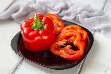 red bell pepper on a black plate