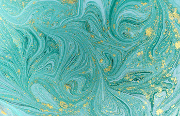 Marble abstract acrylic background. Nature blue marbling artwork texture. Golden glitter.