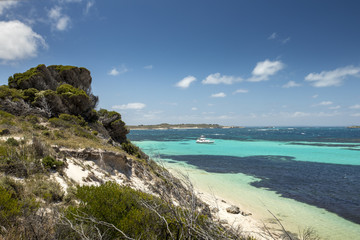 Fototapeta na wymiar The color the Indian Ocean comes to life off the rocky coastline of Rottnest Island, near Perth in Western Australia.