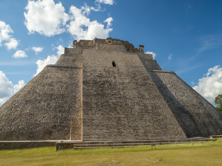 Fototapeta na wymiar The great pyramid of magician in Uxmal archeological site, tourist destination, indian Aztec Mayan Zapotec