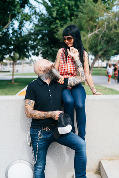 Romantic hipster couple in park, Valencia, Spain