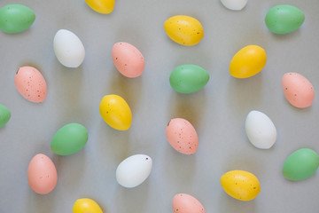 Colorful easter eggs on grey background, easter symbols