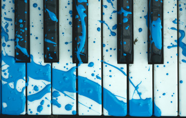piano keyboard with a painted stain