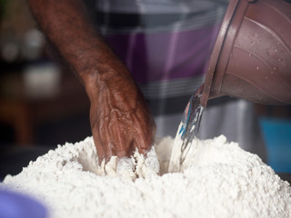 Man preparing roti dough