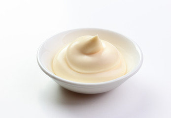 mayonnaise in a dish isolated white background