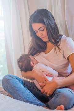 Mother breastfeeding baby