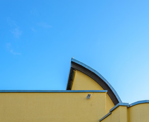 Element of the original building against a clear blue sky. Architectural background