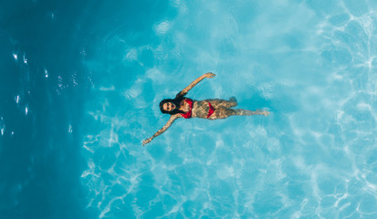 Woman enjoying swimming in a pool