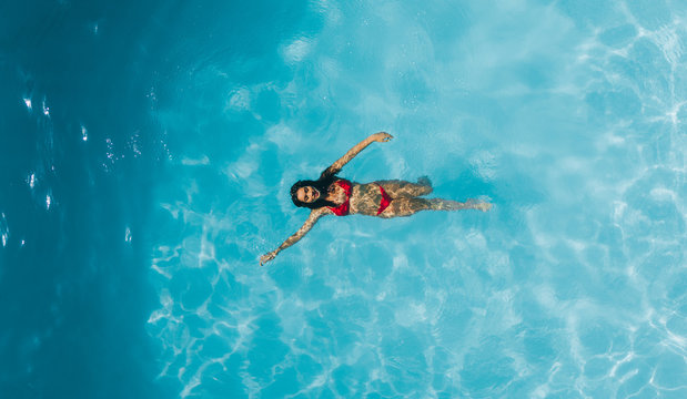 Woman enjoying swimming in a pool