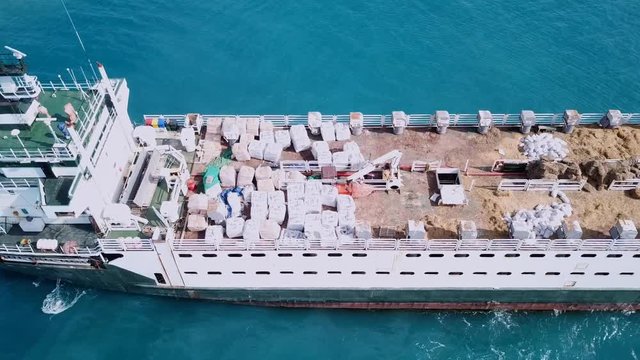 Aerial footage of a Medium size Livestock carrier cruising slowly in  the Mediterranean sea