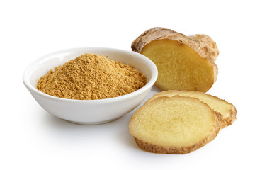 Finely ground dry ginger in white ceramic bowl isolated on white. Fresh whole and sliced root ginger.